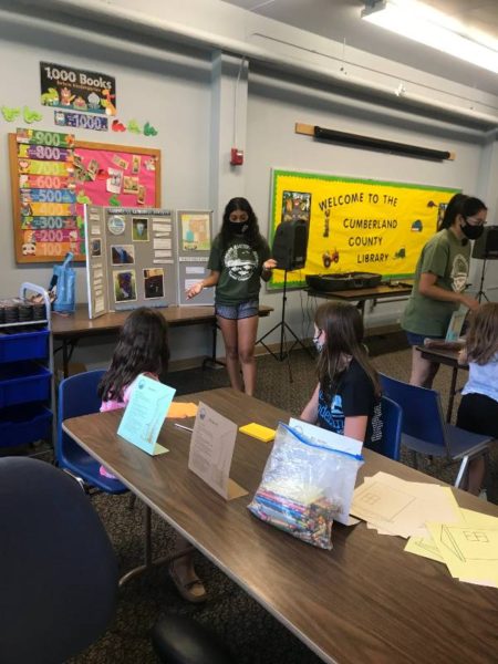 ann teachning kids about rain barrels