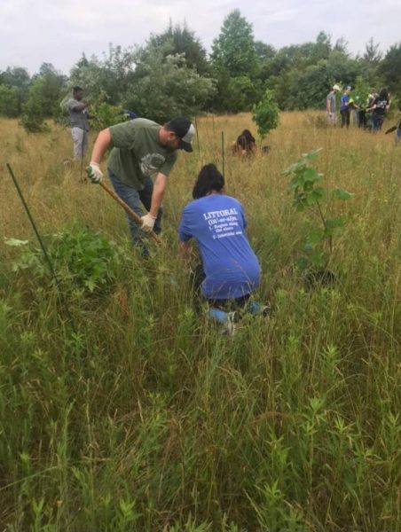 steph and nick planting a tree at schalick high school