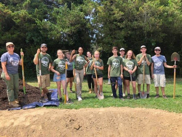 group photo after leveling the rain garden at indian avenue school